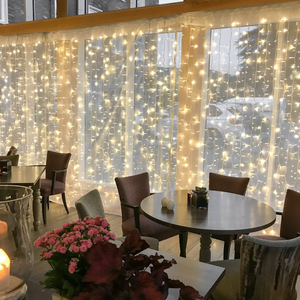 Connectable Warm White Curtain Lights on White Rubber Cable