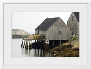 Canada, Nova Scotia, Peggy's Cove. Lobster traps on typical wooden dock