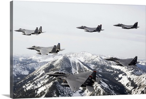 A sixship formation of aircraft fly over the Sawtooth Mountains in Idaho