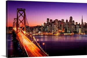 San Francisco skyline and Bay Bridge at sunset, California