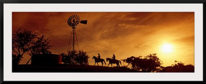 Silhouette of two horse riders at sunset, Hunt, Kerr County, Texas