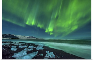 Aurora borealis over the ice beach near Jokulsarlon, Iceland