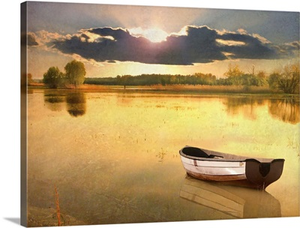 Boat in lake at sunset.