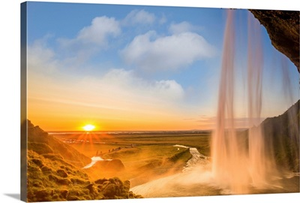Iceland, Seljalandsfoss at sunset, waterfall and sun