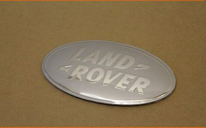LR008976 - Front Grille Badge in Chrome and Silver - Fits SVX Grille on Defender and Discovery 4 - Genuine Land Rover