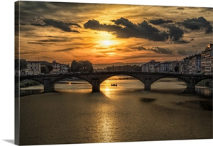 Bridge over the Arno River at sunset in Florence, Italy