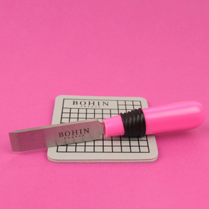 Ouvre boutonnière avec tapis de protection