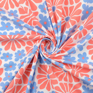 Tissu jersey fantaisie - Fleurs sixties rouges et bleues
