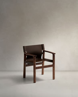 Jan chair made of dark brown recycled leather fibres and FSC 100% solid ash wood with walnut-coloured finish