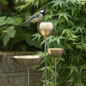 Brass bowl on stainless steel stake