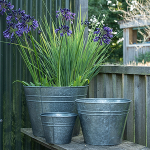 Ringed galvanised metal planter